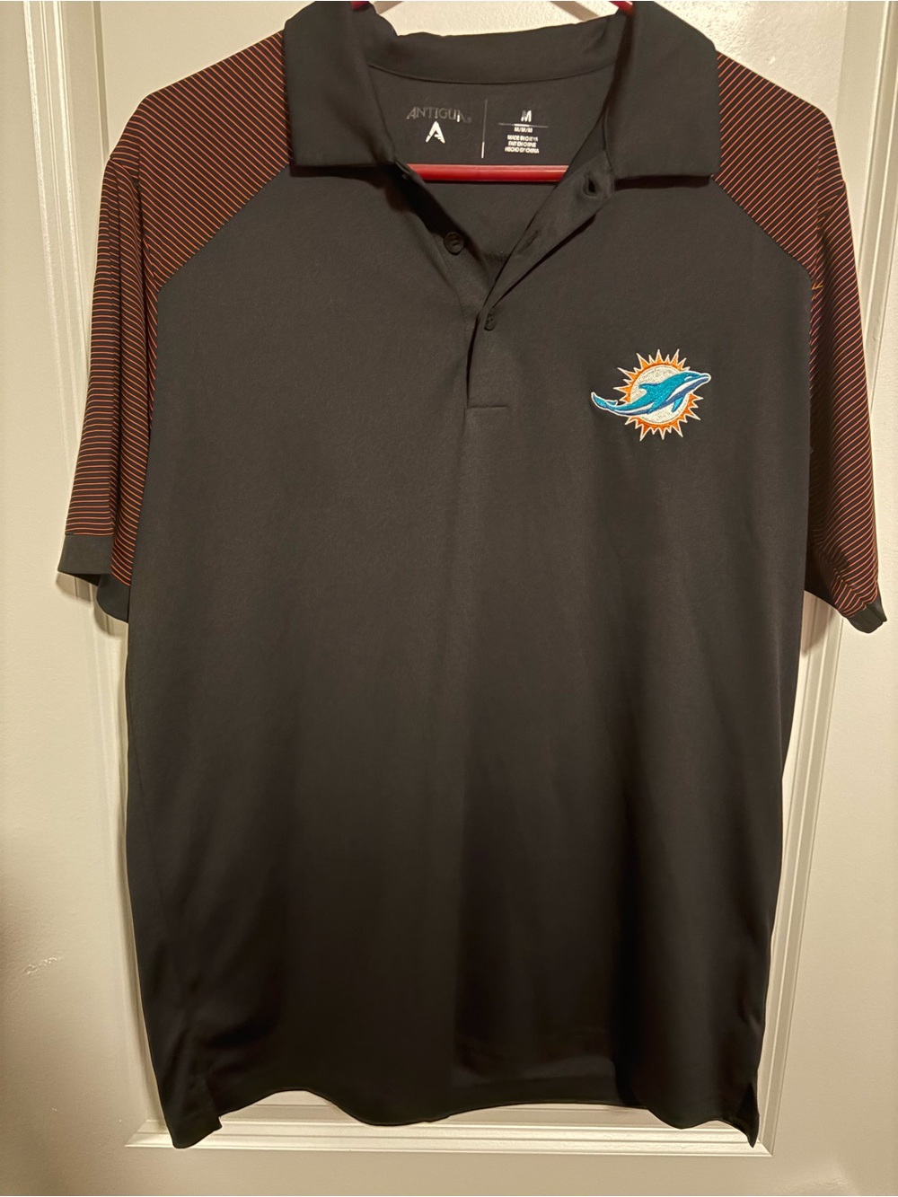 Antigua Black Polo with Brown Striped Raglan Sleeves and Miami Dolphins Crest